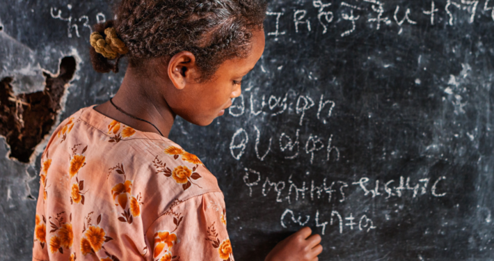 Ethiopian school child learning Amharic